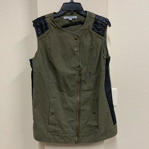 Army green vest with black faux leather details